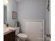 Clean bathroom with dark vanity and toilet at 1316 Neal Hawkins Rd, Gastonia, NC 28056