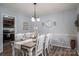 Bright dining room features a farmhouse table with seating for six at 1316 Neal Hawkins Rd, Gastonia, NC 28056