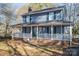 Two-story house with a front porch and rocking chairs at 1316 Neal Hawkins Rd, Gastonia, NC 28056