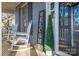 Relaxing front porch with rocking chairs and welcome decor at 1316 Neal Hawkins Rd, Gastonia, NC 28056