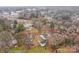 Aerial view of a neighborhood with cozy houses and mature trees in a residential setting at 1618 4Th St, Salisbury, NC 28144