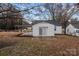 Single-story home with a sliding glass door, small patio, and carport at 1618 4Th St, Salisbury, NC 28144