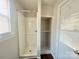 Clean white bathroom with a shower stall and built-in shelves at 1618 4Th St, Salisbury, NC 28144