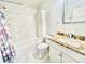 Bathroom featuring marble tiles in the shower, vanity with granite countertops, and tiled flooring at 1618 4Th St, Salisbury, NC 28144
