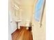 Bathroom with a single sink, toilet and wood flooring at 1618 4Th St, Salisbury, NC 28144