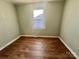 Simple bedroom with hardwood floors and a window at 1618 4Th St, Salisbury, NC 28144