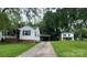 Two white homes on a large lot with a shared driveway and mature trees at 1618 4Th St, Salisbury, NC 28144