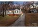 Charming single-story home with brick foundation, covered entry, long driveway, and carport at 1618 4Th St, Salisbury, NC 28144