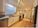Updated kitchen with granite countertops and white cabinets at 1618 4Th St, Salisbury, NC 28144