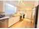 Updated kitchen with stainless steel appliances, granite countertops, and modern lighting at 1618 4Th St, Salisbury, NC 28144