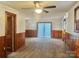 Living room with wood paneling and sliding glass doors at 1618 4Th St, Salisbury, NC 28144