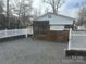 Single wide home with screened porch and gravel driveway at 173 Arrowood Trl # F95, Mount Gilead, NC 27306