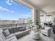 Relaxing balcony featuring comfortable seating and stunning cityscape views at 19329 Watermark Dr # 261/262, Cornelius, NC 28031