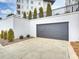 Private one-car garage with modern gray door at 19329 Watermark Dr # 261/262, Cornelius, NC 28031