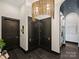 Modern hallway with dark doors and unique lighting at 19329 Watermark Dr # 261/262, Cornelius, NC 28031