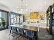 Modern kitchen with gold accents and breakfast bar at 19329 Watermark Dr # 261/262, Cornelius, NC 28031