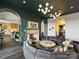 Elegant living room with curved sectional sofa and fireplace at 19329 Watermark Dr # 261/262, Cornelius, NC 28031