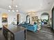 Open living area with teal velvet sofas and a cozy fireplace at 19329 Watermark Dr # 261/262, Cornelius, NC 28031
