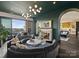Sophisticated living room with curved sectional and a view at 19329 Watermark Dr # 261/262, Cornelius, NC 28031