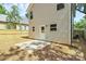 Spacious backyard with a concrete patio and a new wood fence at 204 N Yadkin Ave, Spencer, NC 28150