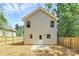 Backyard with newly installed wood fence and concrete patio at 204 N Yadkin Ave, Spencer, NC 28150
