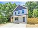 Charming home with covered porch, freshly landscaped front yard, and new fence at 204 N Yadkin Ave, Spencer, NC 28150