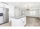 Stylish kitchen with an island, stainless steel appliances, and direct access to the living area at 204 N Yadkin Ave, Spencer, NC 28150