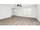 Bright living room with modern light-colored flooring, and abundant natural light at 204 N Yadkin Ave, Spencer, NC 28150