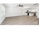 Bright, spacious living room featuring modern ceiling fan and stylish, light-colored flooring at 204 N Yadkin Ave, Spencer, NC 28150