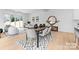 Open concept dining area with wood table and modern light fixture at 2066 Eaton Rd, Charlotte, NC 28205