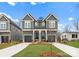 Two-story craftsman home with gray siding, white trim, and a two-car garage at 2066 Eaton Rd, Charlotte, NC 28205