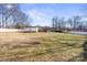 Large backyard with white vinyl fence and detached garage at 220 Augusta Dr, Statesville, NC 28625