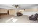 Spacious basement recreation area with leather seating at 220 Augusta Dr, Statesville, NC 28625