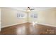 Bright bedroom with hardwood floors and two windows at 220 Augusta Dr, Statesville, NC 28625