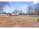 White detached garage with solar panels on the roof at 220 Augusta Dr, Statesville, NC 28625