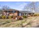 Brick ranch house with mature trees and landscaping at 220 Augusta Dr, Statesville, NC 28625