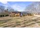 Ranch home exterior with a spacious lawn at 220 Augusta Dr, Statesville, NC 28625