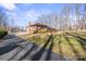 Side view of a brick ranch house and driveway at 220 Augusta Dr, Statesville, NC 28625