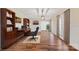 Home office with built-in shelving and hardwood floors at 220 Augusta Dr, Statesville, NC 28625