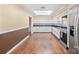Kitchen with white cabinets, granite counters, and stainless steel appliances at 220 Augusta Dr, Statesville, NC 28625