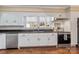 Updated kitchen with white cabinets and stainless steel appliances at 220 Augusta Dr, Statesville, NC 28625