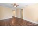 Hardwood floor living room with access to bathroom and other rooms at 220 Augusta Dr, Statesville, NC 28625