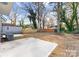 Large backyard with patio and mature trees at 2221 Edison St, Charlotte, NC 28206