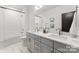 Elegant bathroom featuring a double sink vanity, modern fixtures, and a separate tub and shower at 2221 Edison St, Charlotte, NC 28206