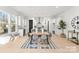 Open dining area featuring modern fixtures, light wood floors, and an open kitchen at 2221 Edison St, Charlotte, NC 28206