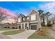New construction duplex boasting neutral color palette, attached garages, and modern curb appeal at 2221 Edison St, Charlotte, NC 28206