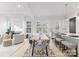Open concept view of the kitchen and dining room into living room with fireplace and lots of natural light at 2221 Edison St, Charlotte, NC 28206