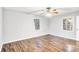 Bright bedroom with hardwood floors and ceiling fan at 27097 Cove Ln, Tega Cay, SC 29708