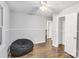 Bedroom with hardwood floors, closet, and ceiling fan at 27097 Cove Ln, Tega Cay, SC 29708