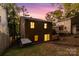 Back of the house, showcasing a walkout basement and a fenced backyard at 27097 Cove Ln, Tega Cay, SC 29708
